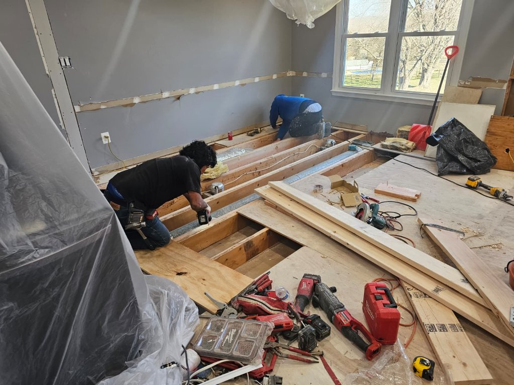 Diamond Remodeling contractor reviewing plans on a job site